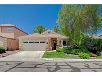Charming single-story home with a well-manicured front yard and a two-car garage in a quiet neighborhood at 10198 Timber Willow Ave, Las Vegas, NV 89135