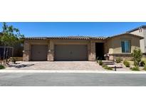 Charming single-story home featuring a three car garage and welcoming entryway at 10904 Ellis Pointe Ave, Las Vegas, NV 89166