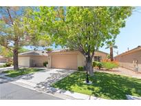 Charming single-story home with a well-maintained lawn and mature trees offering shade and curb appeal at 3495 Eagle Bend St, Las Vegas, NV 89122
