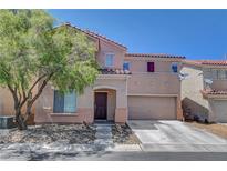 Charming two-story home featuring a two-car garage and well-maintained landscaping at 554 Haunts Walk Ave, Las Vegas, NV 89178