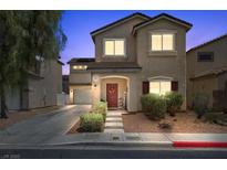 Charming two-story home featuring a well-maintained front yard, covered porch, and attached garage, perfect for Gathering living at 5656 Fast Payout Ct, Las Vegas, NV 89122