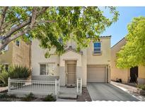 Charming two-story home featuring a covered front porch and a one-car garage at 7640 Woven Memories St, Las Vegas, NV 89149