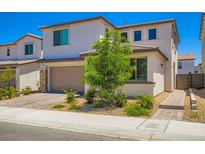 Charming two-story home featuring landscaped front yard and a two-car garage at 9440 Lunar Ray St, Las Vegas, NV 89143