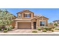 Inviting two-story home with a meticulously maintained front yard and attached two-car garage at 10961 Winter Rise St, Las Vegas, NV 89141