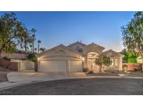 Inviting single-story home with a three-car garage and well-maintained landscaping at 1145 Glacier Park Ct, Henderson, NV 89052