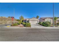 Charming home is complemented by drought-tolerant landscaping and a convenient two-car garage at 2150 Maple Heights Ct, Henderson, NV 89052