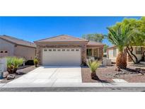 Charming single-story home with a stone facade, well-manicured landscaping, and a two-car garage at 2508 Chasma Dr, Henderson, NV 89044