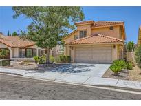Charming two-story home with a well-maintained front yard and a two-car garage at 333 Abbington St, Henderson, NV 89074