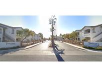 A gated entrance to the Terrasanta Condominiums community with lush landscaping and well-maintained buildings at 5655 E Sahara Ave # 1053, Las Vegas, NV 89142
