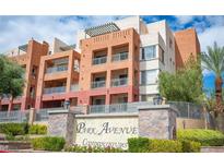 Stylish condominium building featuring balconies and modern architectural design in a landscaped setting at 63 E Agate Ave # 202, Las Vegas, NV 89123