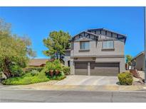 Two story home featuring a two car garage, landscaped front yard and inviting curb appeal at 68 Vista Del Mar St, Henderson, NV 89012
