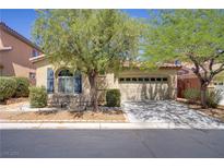 Charming single story home featuring mature trees, well maintained landscaping and a two car garage at 9864 Maspalomas St, Las Vegas, NV 89178