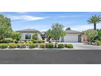 Beautiful home with well-maintained landscaping, stone accents, and a spacious three-car garage at 10325 Sweet Fennel Dr, Las Vegas, NV 89135