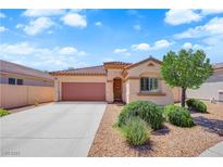 Charming single-story home featuring a desert landscape, a two car garage, and a tiled roof at 11139 Zarod Rd, Las Vegas, NV 89135