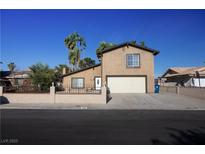 Charming two-story home with a well-maintained front yard and a spacious two-car garage, perfect for a growing Gathering at 1340 Lucky St, Las Vegas, NV 89104
