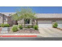 Charming single story home with a two car garage and desert landscaping at 201 Crown Imperial St, Henderson, NV 89074