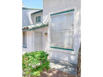 Charming townhouse with decorative tile accents and secure front entry at 2471 Old Forge Ln # 105, Las Vegas, NV 89121
