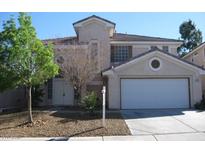 Charming two-story home featuring a two-car garage and a well-maintained front yard at 254 Horizon Pointe Cir, Henderson, NV 89012