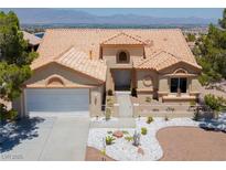 Charming single-story home featuring a well-manicured front yard and a neutral-toned stucco exterior at 2904 Bow Bridge Dr, Las Vegas, NV 89134