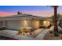 Charming single-story home with a tile roof, low-maintenance landscaping, and an attached two-car garage at 3337 Partridge Run St, Laughlin, NV 89029