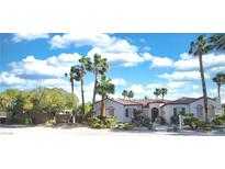 Charming single-story home with beautiful landscaping, lush trees, and a tile roof at 3540 Wisdom Ct, Las Vegas, NV 89120