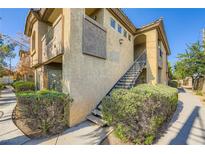 Charming condo exterior with well-maintained landscaping and inviting staircase, creating a welcoming atmosphere at 4400 S Jones Blvd # 2007, Las Vegas, NV 89103