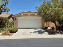 Charming home featuring a two-car garage and well-maintained landscaping at 4814 Regalo Bello St, Las Vegas, NV 89135