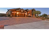 Charming single-story home featuring a brick driveway and a well-manicured front yard at 6208 W Rome Blvd, Las Vegas, NV 89131