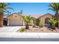 Charming single-story home with desert landscaping and palm trees in a sunny neighborhood at 7540 Flowing Stream Dr, Las Vegas, NV 89131