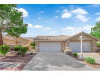 Charming single-story home with a tile roof and well-manicured landscaping at 9412 Mount Cherie Ave # 102, Las Vegas, NV 89129