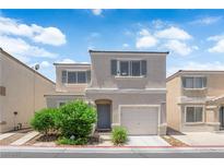 Charming two-story home with stucco exterior, manicured landscaping, and attached one car garage at 9957 Fine Fern St, Las Vegas, NV 89183