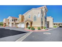 Charming townhouse with stucco exterior and well-maintained landscaping at 9975 Peace Way # 1024, Las Vegas, NV 89147