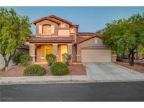 Charming two-story home featuring a well-manicured front yard, attached garage, and inviting curb appeal at 1011 Pecos River Ave, Henderson, NV 89002
