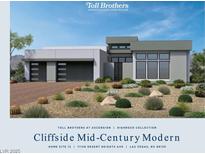 Stunning mid-century modern home with desert landscaping, and a three-car garage at 11149 Desert Heights Ave, Las Vegas, NV 89135