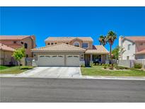 Charming two-story home with a well-manicured lawn and a three car garage at 1316 Borderwood Ln, North Las Vegas, NV 89031