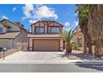 Charming two-story home featuring a two-car garage, well-maintained landscaping, and a welcoming facade at 1711 Ember Glow Cir, Las Vegas, NV 89119