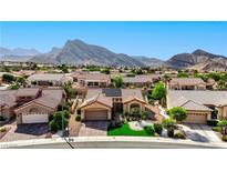 Charming single story home featuring well manicured landscaping and an attached garage nestled in a vibrant community at 2605 Orchid Valley Dr, Las Vegas, NV 89134