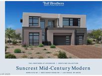 A modern Suncrest Mid-Century home with a two-car garage and low maintenance desert landscaping at 4853 Shady Ridge Dr, Las Vegas, NV 89135