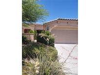 Charming single-story home featuring a two-car garage and desert landscaping at 5389 Progresso St, Las Vegas, NV 89135