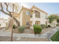 Beautiful two-story condo featuring a private balcony, lush landscaping, and a convenient stairway entrance at 6808 Indian Chief Dr # 204, Las Vegas, NV 89130