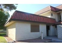 Exterior view of home featuring stucco siding and a red tile roof at 761 Bourbon St # 5, Pahrump, NV 89048