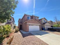 Charming two-story home with a two-car garage and a well-maintained front yard at 9530 Windsor Forest Ct, Las Vegas, NV 89123