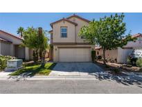 Two-story home with a two car garage and a well-manicured lawn at 11147 Verismo St, Las Vegas, NV 89141
