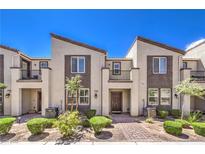 Charming townhome with desert landscaping, private balconies, and convenient front entrances at 1197 Mission View Ct, Henderson, NV 89002