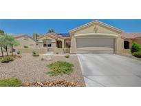 Charming single-story home with desert landscaping and a spacious two-car garage at 1466 Fieldbrook St, Henderson, NV 89052
