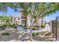 Well-maintained condo complex with lush landscaping, sidewalks, and inviting exterior features at 2325 Windmill Pkwy # 1622, Henderson, NV 89074