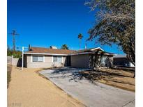 Charming single-story home featuring a spacious driveway and desert-friendly landscaping at , Las Vegas, NV 89121