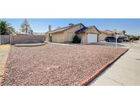 Charming single-story home featuring a well-kept front yard with desert landscaping and a private gated entrance at 1708 Anzio St, Las Vegas, NV 89108