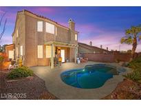 A refreshing backyard pool and patio area with a pergola, perfect for outdoor relaxation and entertaining guests at 262 Cielito Lindo St, Henderson, NV 89012