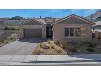 Beautiful single-story home featuring a two-car garage and tastefully landscaped front yard at 2931 Raywood Ash Dr, Las Vegas, NV 89138